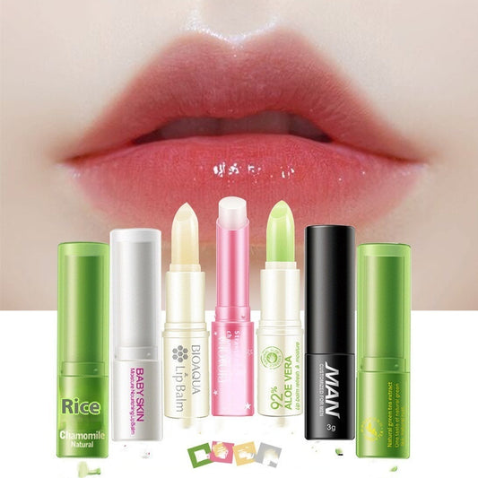 Collection of lip balms with visible brand names against a close-up of lips.